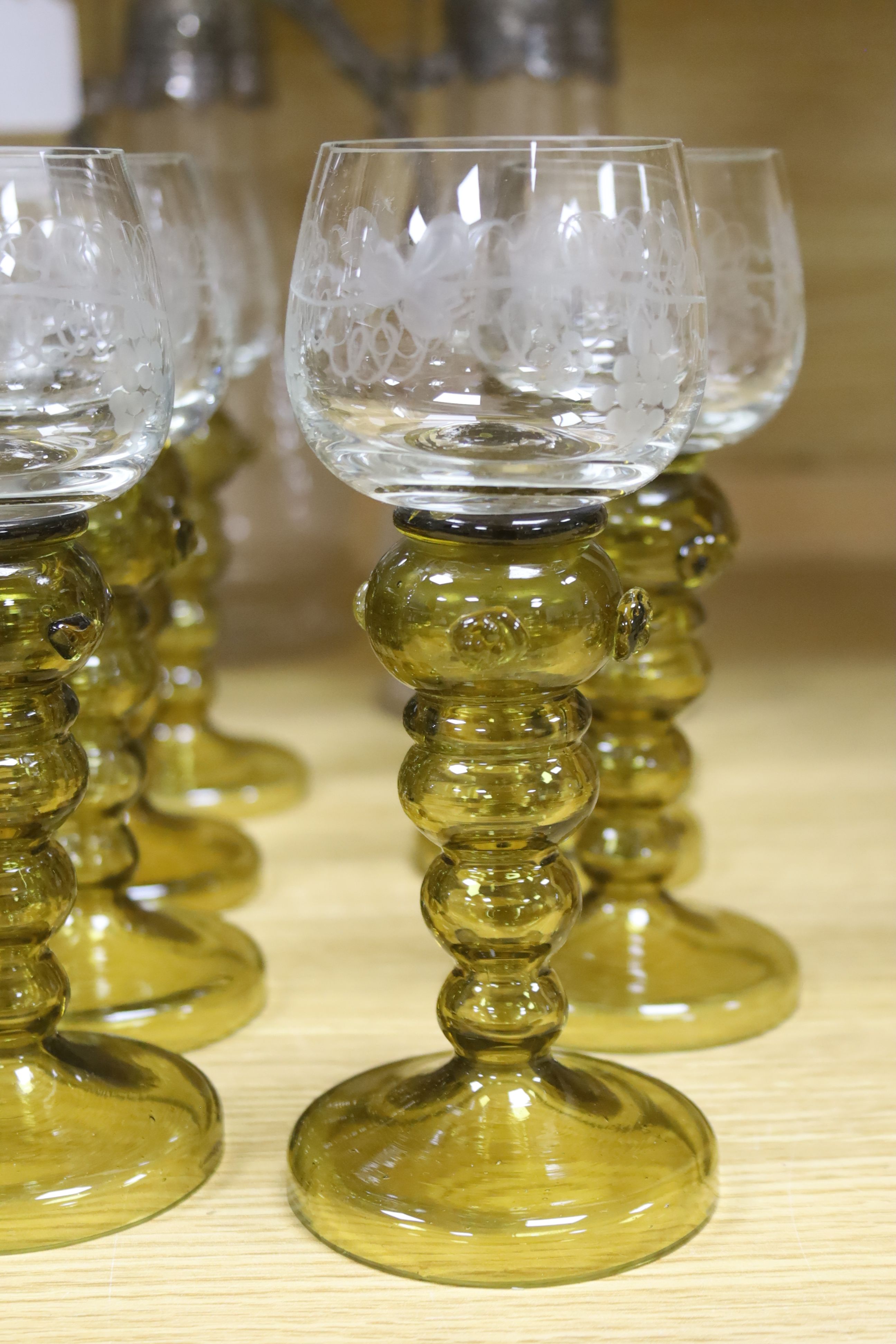 A pair of Victorian claret jugs and a set of eight green hock glasses